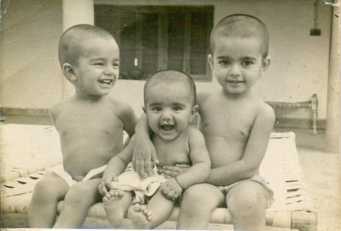 Qasim as a 3 year old with his 2 sisters in Sialkot (Guess which one).