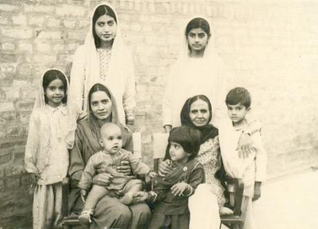 Qasim (5 year old) (standing on extreme left) with his dadi in Chinot, surrounded by his 3 sisters and mother.