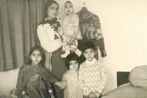Qasim (6 years old) with his sisters and mother in Bahawalpur.